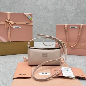 {Pink} Miu Miu small crossbody bag—an Isetan exclusive collection that remains a must-have for the autumn/winter season and is sure to hold a prominent place in the fashion world. Dimensions: 19 x 8 x 10 cm.
